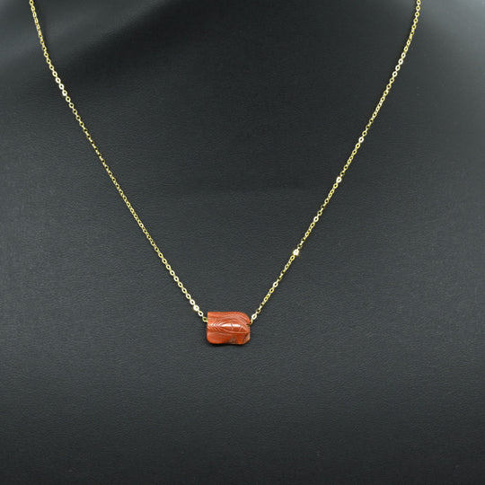 An Egyptian Carnelian Wedjat eye Pendant, New Kingdom, 18th - 19th Dynasty, ca. 1550 - 1290 BCE