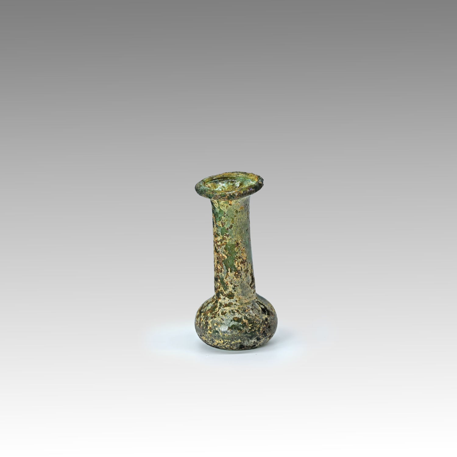 A miniature Roman Green Glass vial, ca. 1st - 3rd century CE