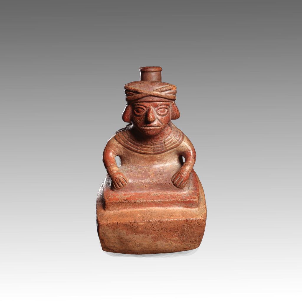 A Moche Terracotta Stirrup-Spout Vessel Depicting a Seated Dignitary, Moche II, ca. 300 - 500 CE