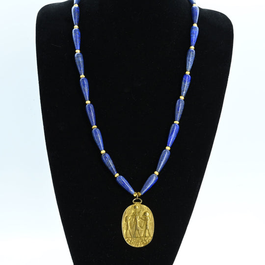 A Vintage King Tut Gold-tone Pendant set as a necklace, MMA, 1976