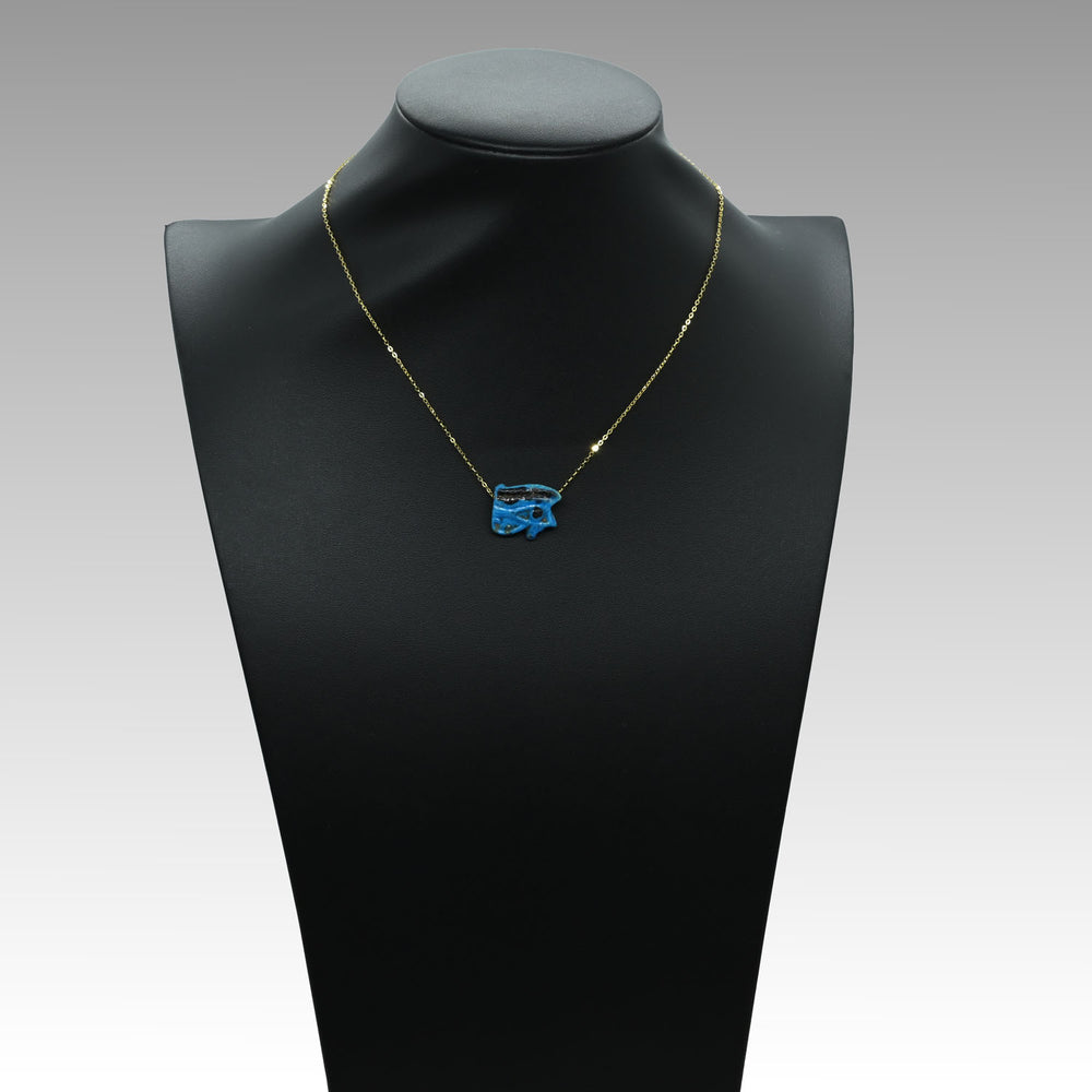 An Egyptian blue faience wedjet eye pendant, 21st Dynasty , ca. 1069 - 945 BCE