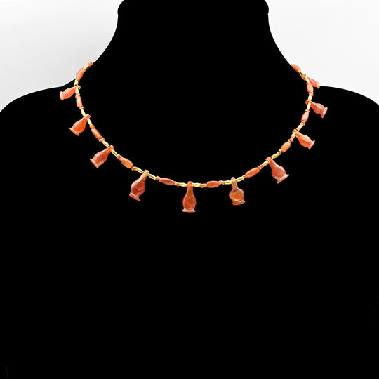 An Egyptian Carnelian Poppy Bead Necklace, 18th Dynasty, Amarna Period, ca.  1364 - 1347 BCE