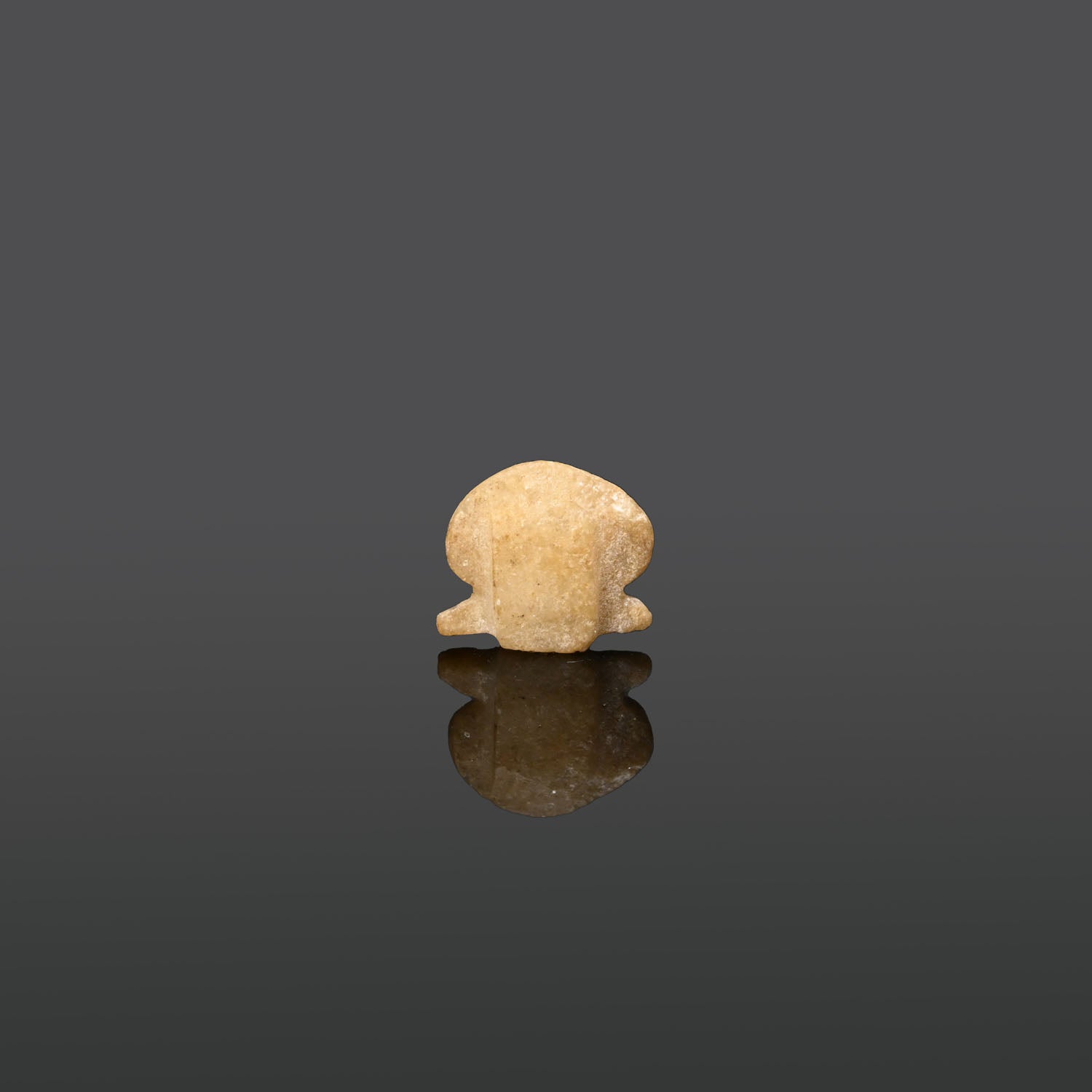 An Egyptian Alabaster Sun Disc Amulet, Late Period, ca. 664 - 332 BCE