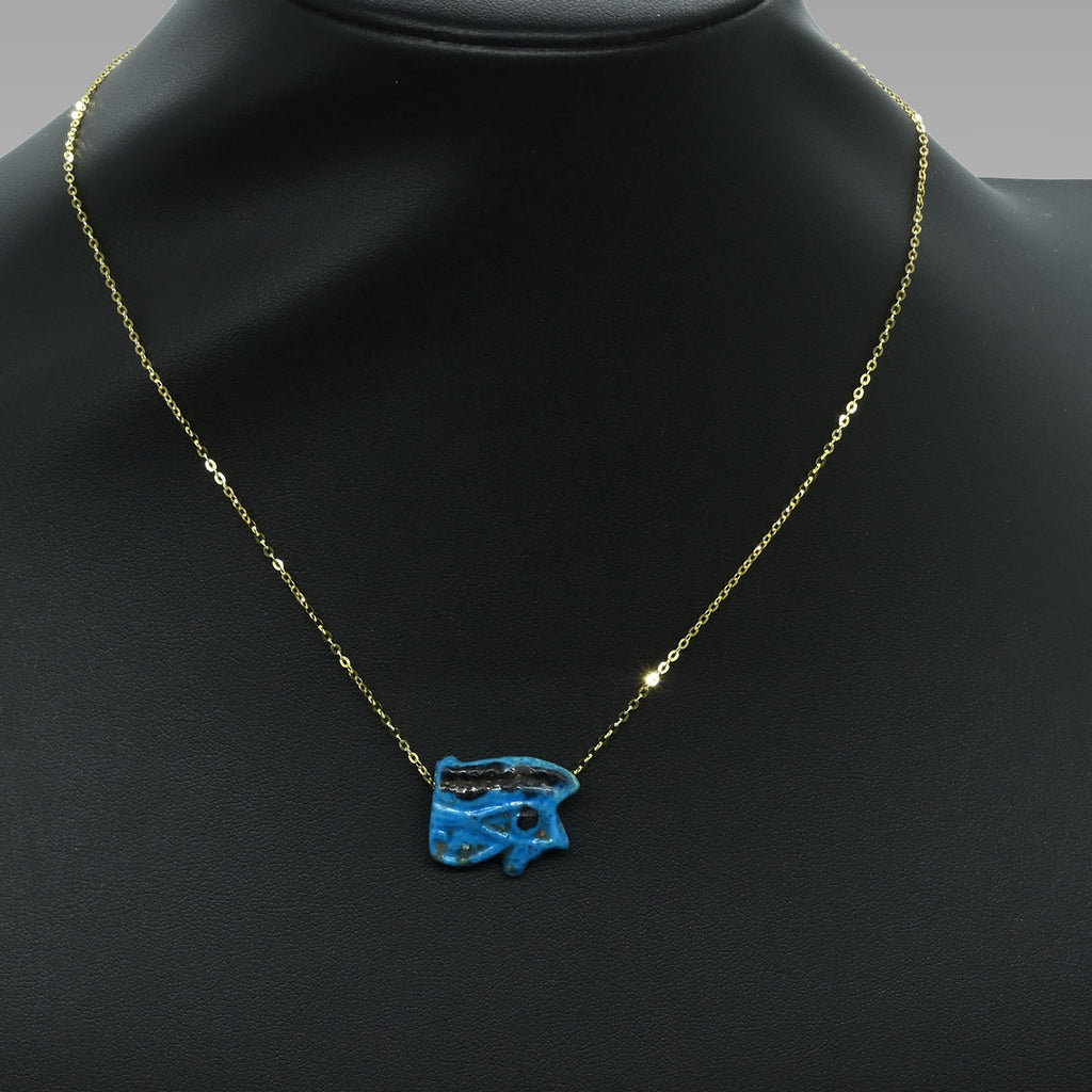 An Egyptian blue faience wedjet eye pendant, 21st Dynasty , ca. 1069 - 945 BCE