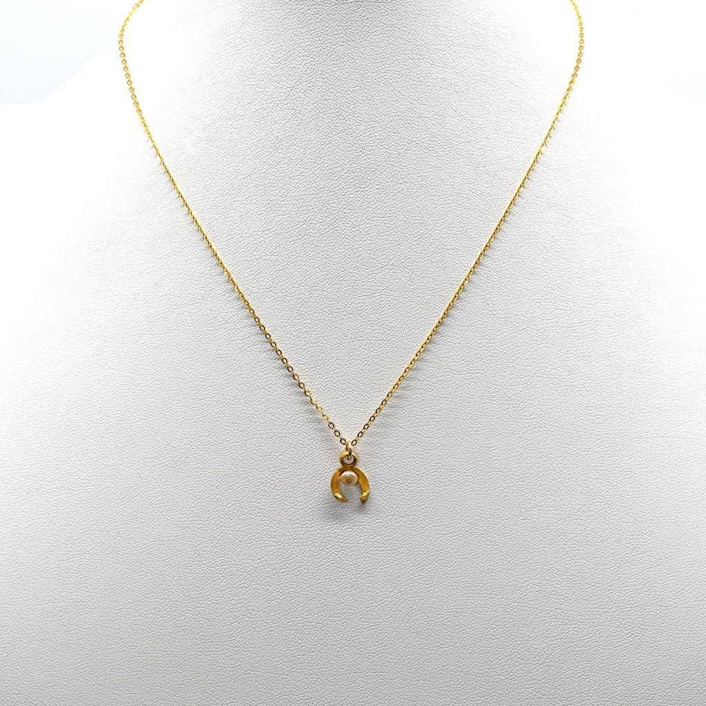 A tiny Roman Gold and Pearl Luna Pendant, Roman Imperial Period, ca. 1st - 2nd century CE