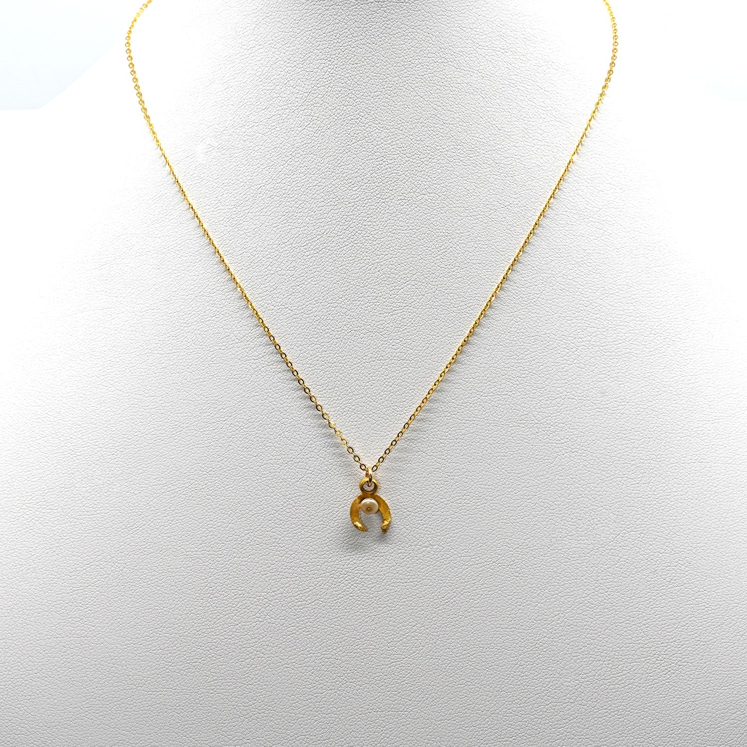 A tiny Roman Gold and Pearl Luna Pendant, Roman Imperial Period, ca. 1st - 2nd century CE