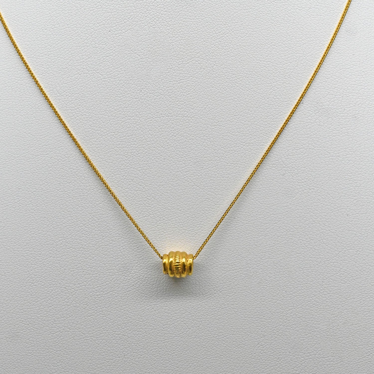 A Persian Gold Bead Pendant, Achaemenid Period, ca. 550 - 330 BCE