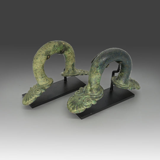 A pair of Greek bronze Hydria Handles, Classical period, ca. 5th century BCE