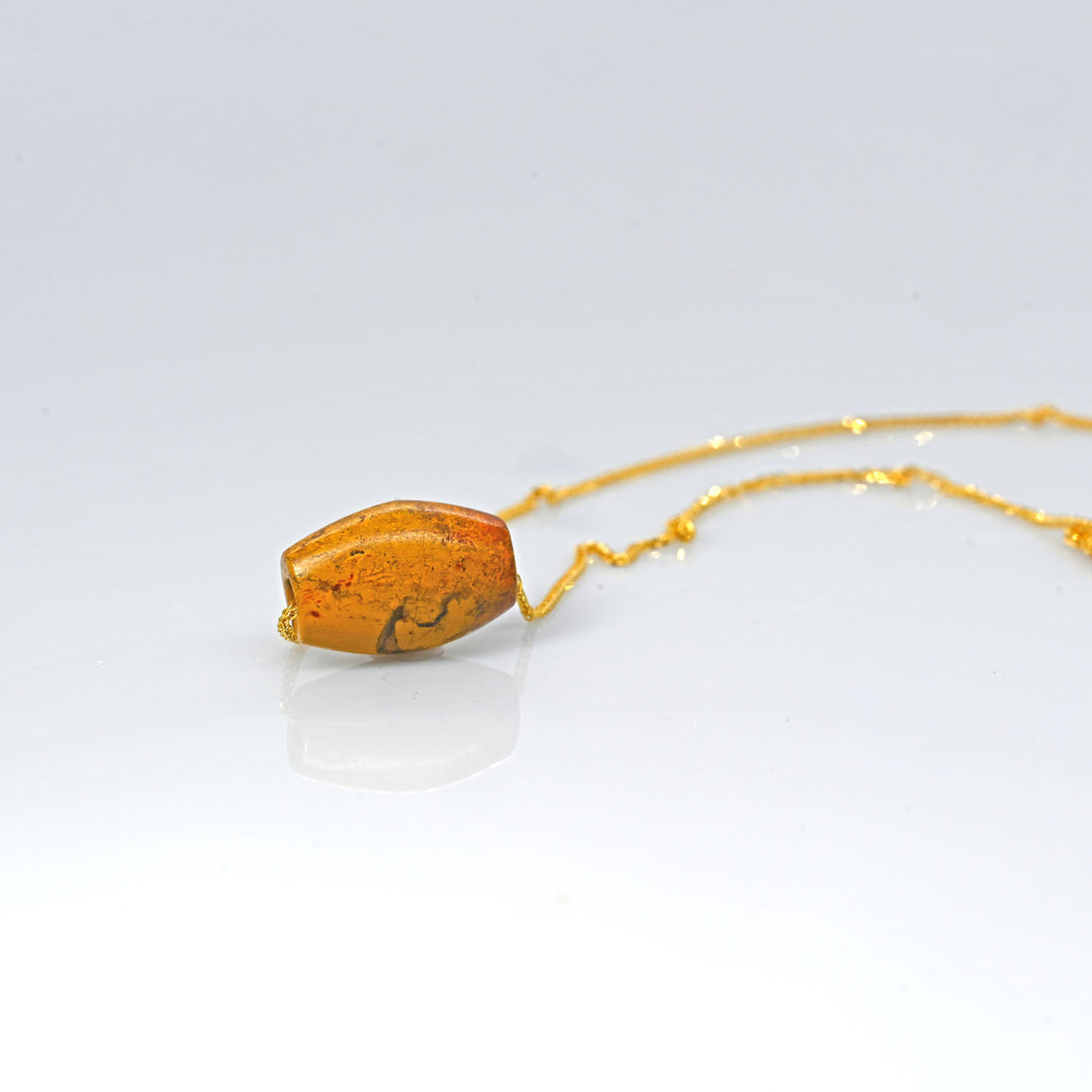 A rare Egyptian Yellow Jasper Bead Pendant, New Kingdom, 18th Dynasty, ca. 1550-1295 BCE