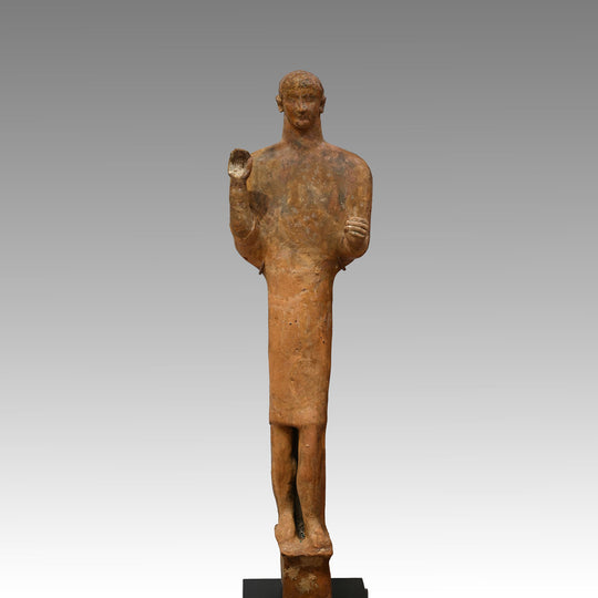 A large Phoenician terracotta standing youth, Neo Assyrian Period, ca. 6th century BCE