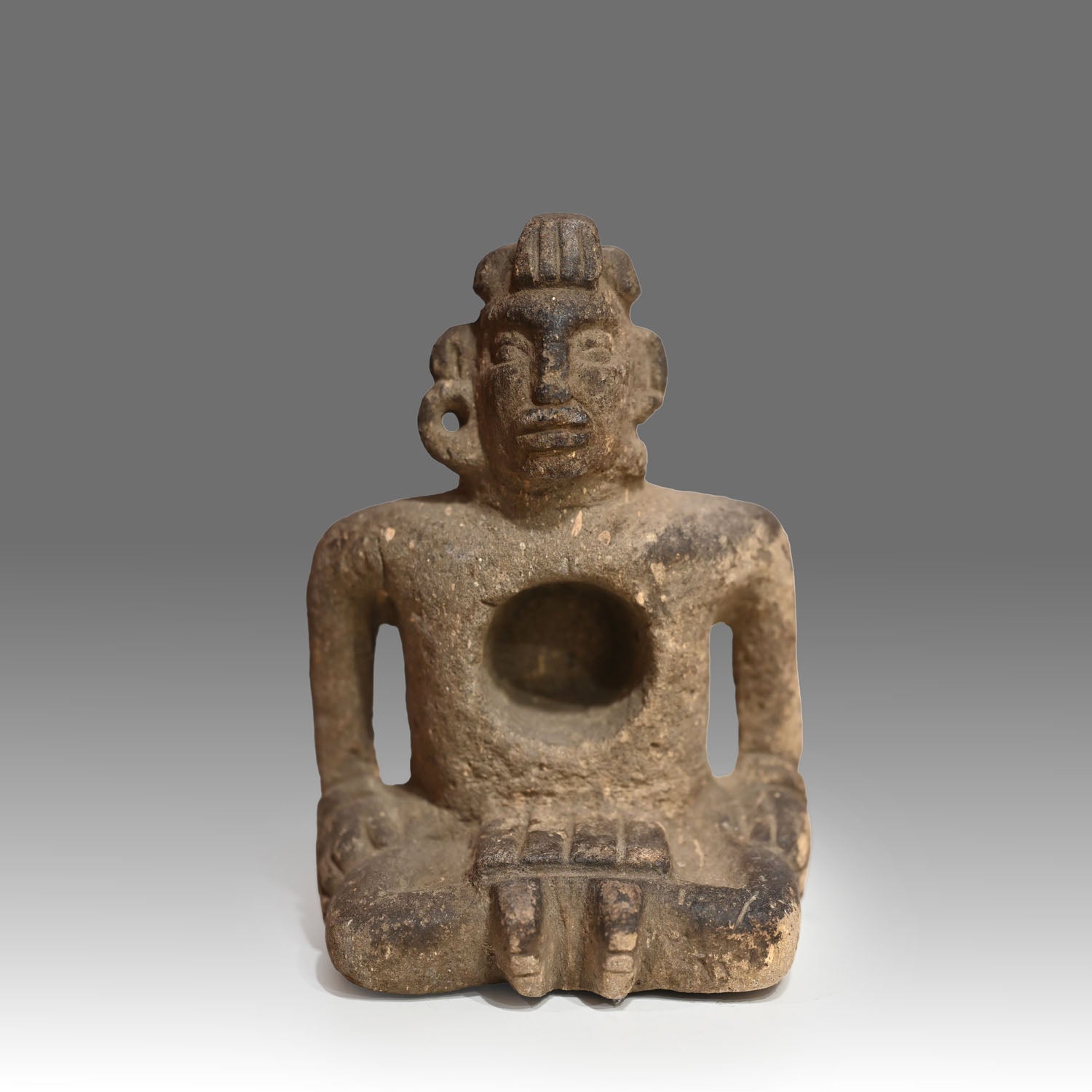 Maya Sandstone Seated Deity Figure, ca. 200 - 500 CE