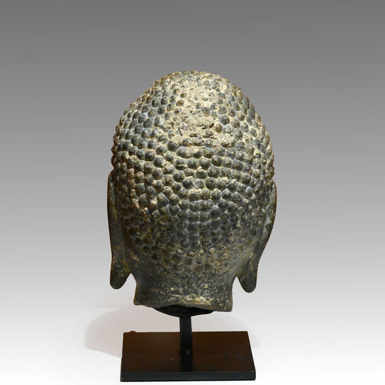 A Chinese Grey Limestone Head of a Buddha, Shandong Province, Northern Qi dynasty, ca. 550 - 577 CE