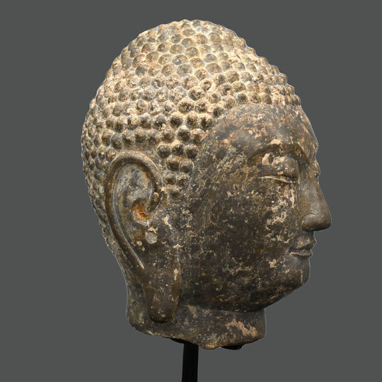 A Chinese Grey Limestone Head of a Buddha, Shandong Province, Northern Qi dynasty, ca. 550 - 577 CE