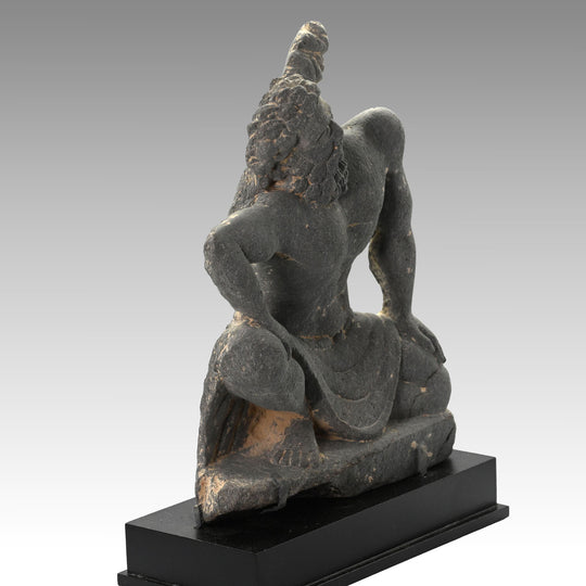 A Gandharian Gray Schist Figure of a Kneeling Atlas, ca. 2nd - 4th century CE