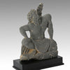 A Gandharian Gray Schist Figure of a Kneeling Atlas, ca. 2nd - 4th century CE