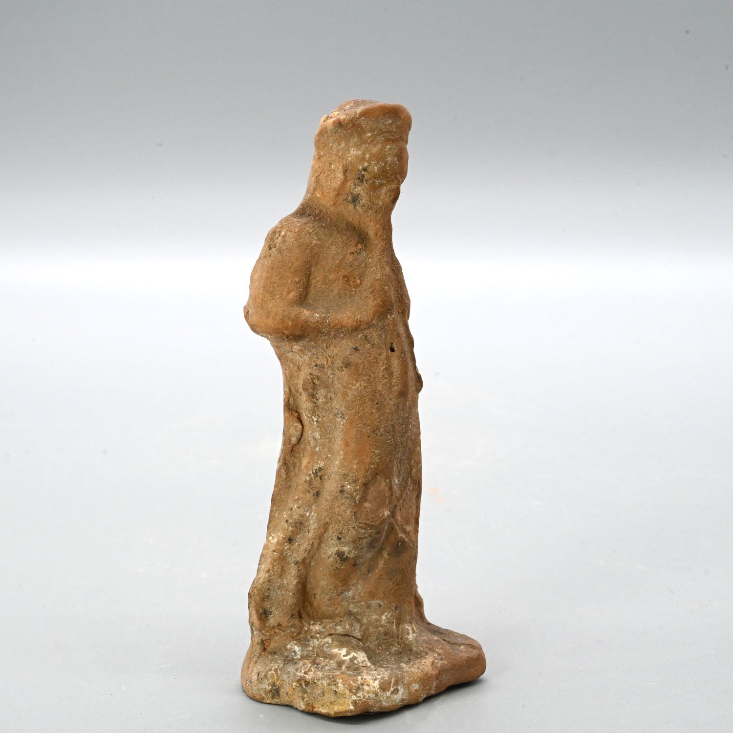 An Attic terracotta figurine of a Girl playing Auloi (double pipes)<br><em>Tanagra, ca. 3rd century BCE</em>