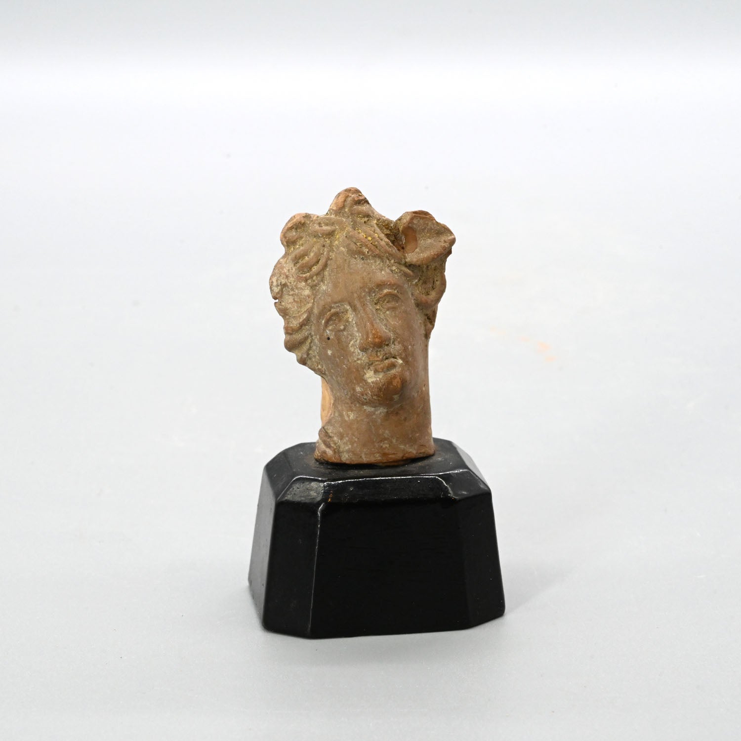 A Greek Terracotta Head of Ariadne, Hellenistic Period, ca. 3rd - 1st centuy BCE