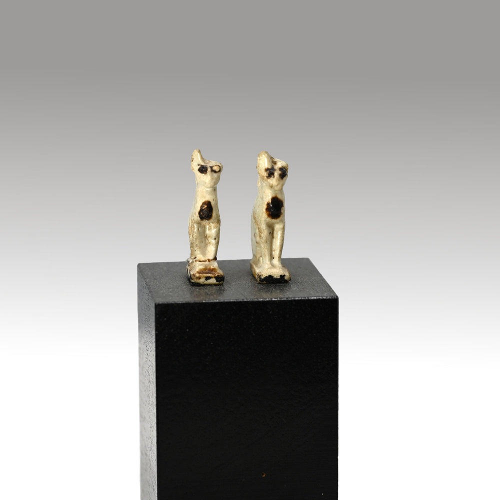 A pair of Egyptian faience Cat Amulets, Dynasties 22 - 26, ca. 945 - 525 BCE