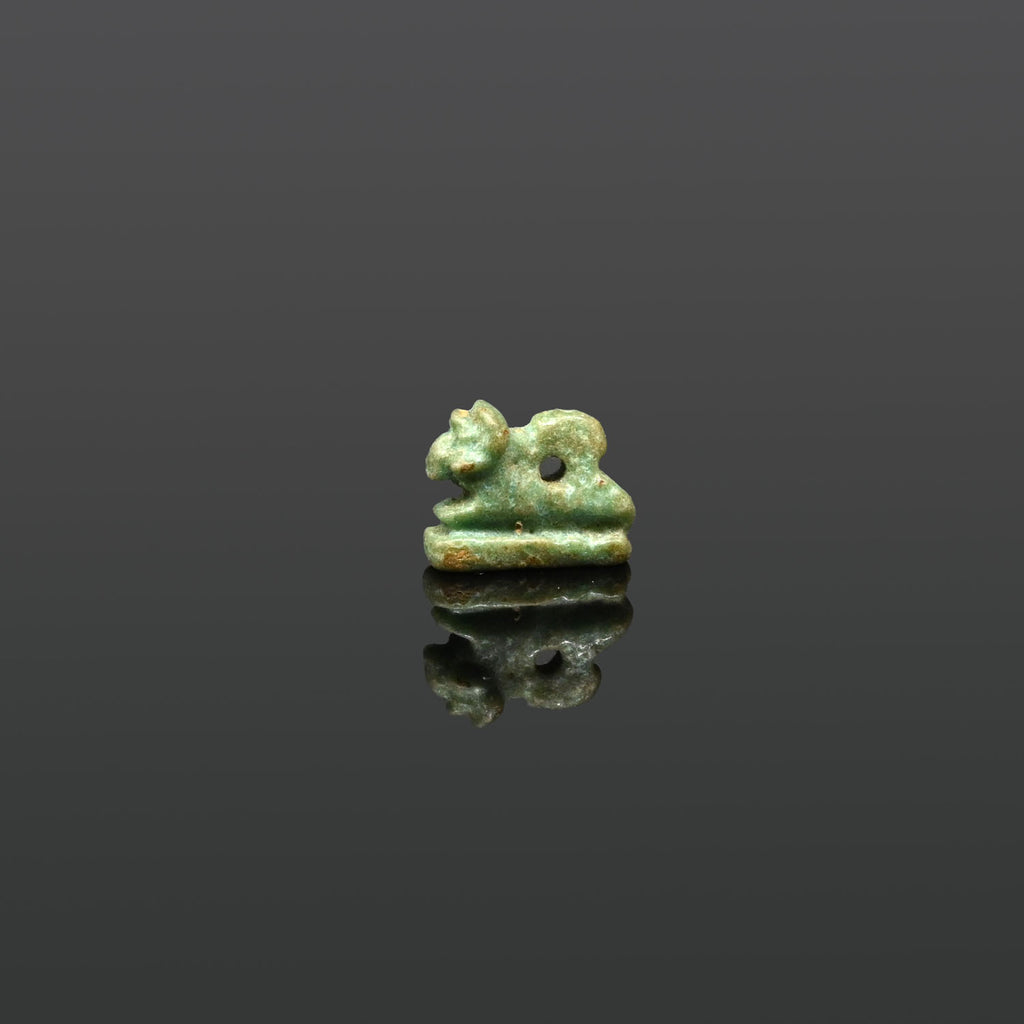 An Egyptian Faience Amulet of a Recumbent Ram, Late Period, ca. 664 - 332 BCE
