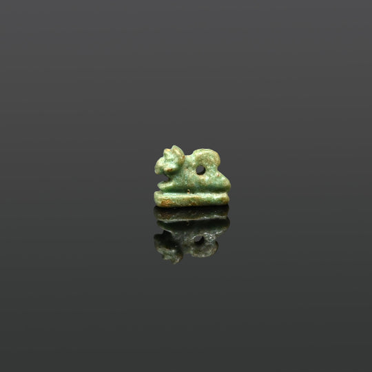 An Egyptian Faience Amulet of a Recumbent Ram, Late Period, ca. 664 - 332 BCE