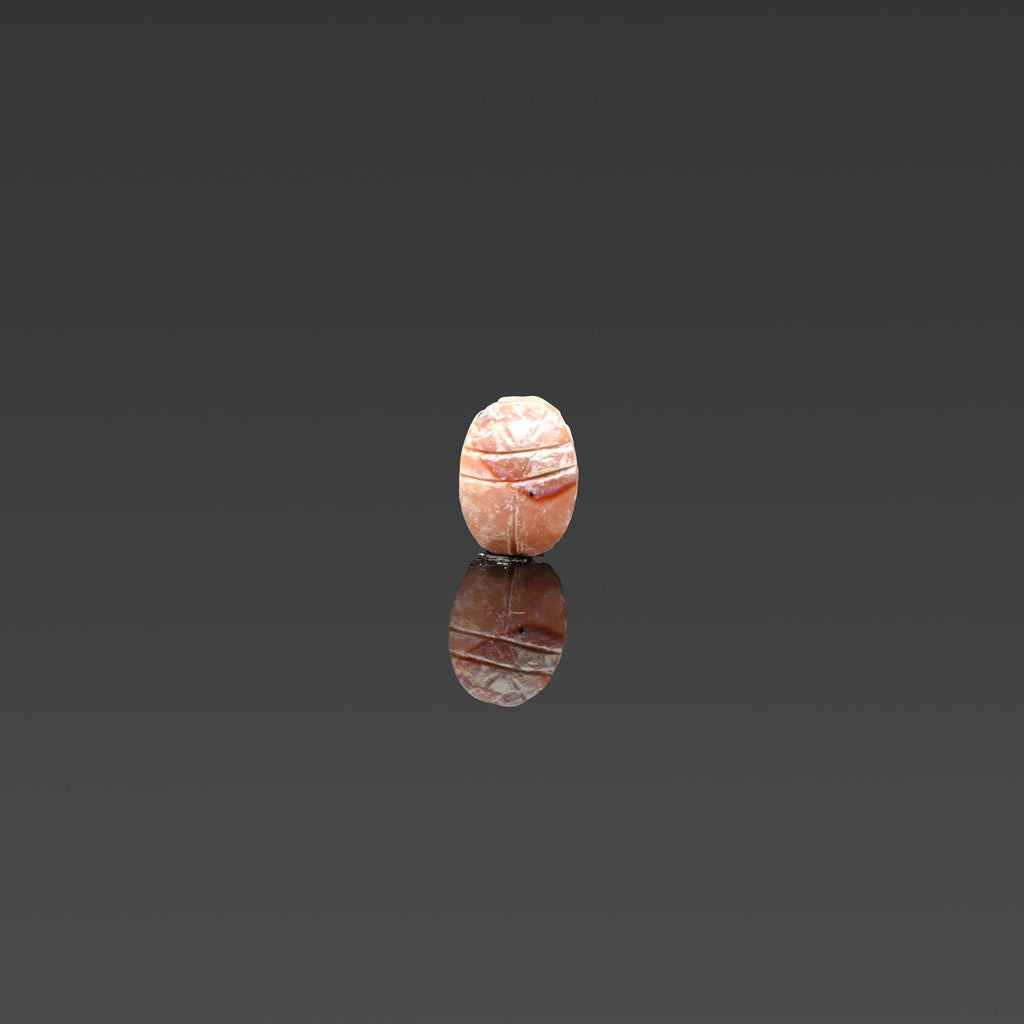 An Egyptian Pink Quartzite Scarab, Late Period, ca. 664 - 332 BCE