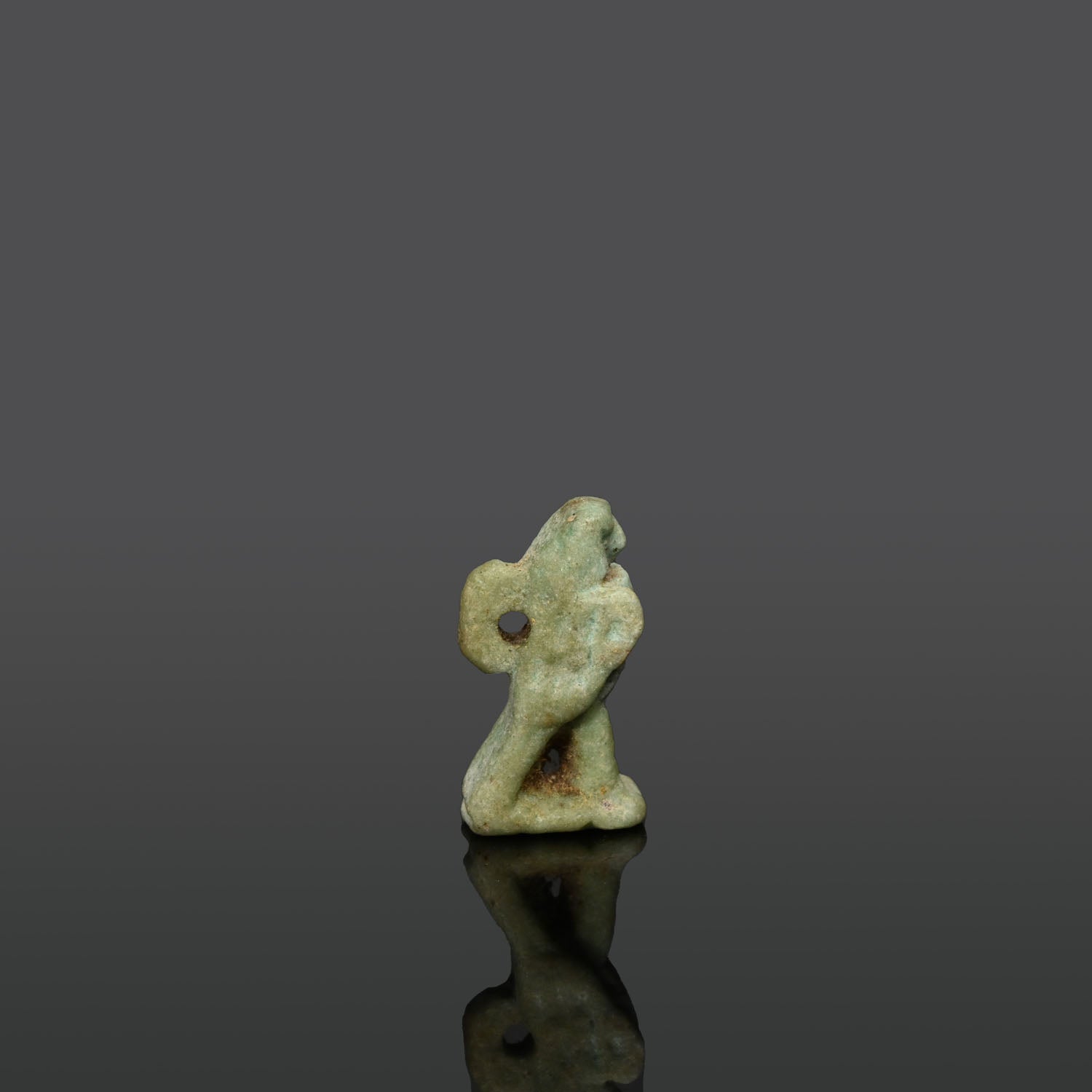 An Egyptian Green Faience Falcon Amulet, Late Period, ca. 664 - 332 BCE