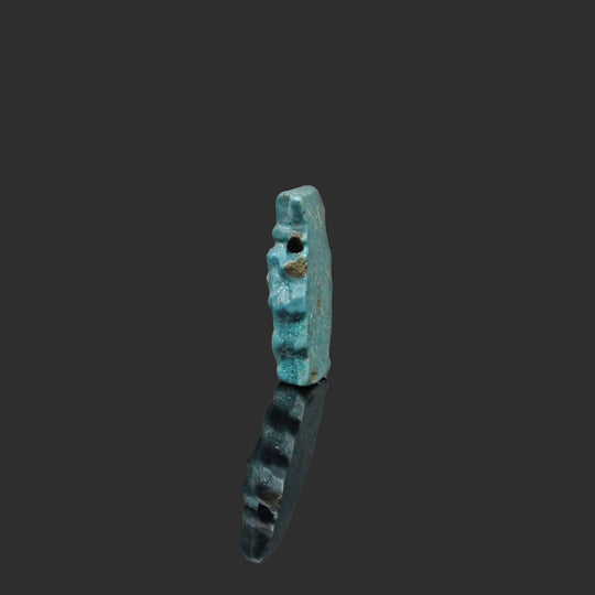 An Egyptian Blue Faience Bes Amulet, Late Period, ca. 664 - 332 BCE