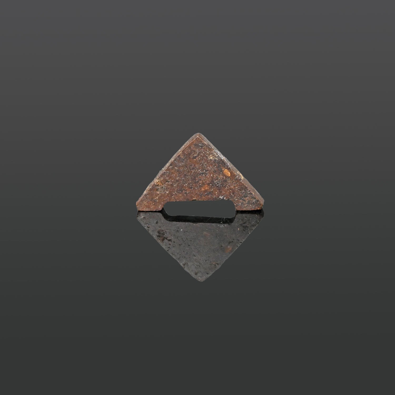 An Egyptian Hematite Plummet Amulet, Late Period, ca. 664 - 332 BCE