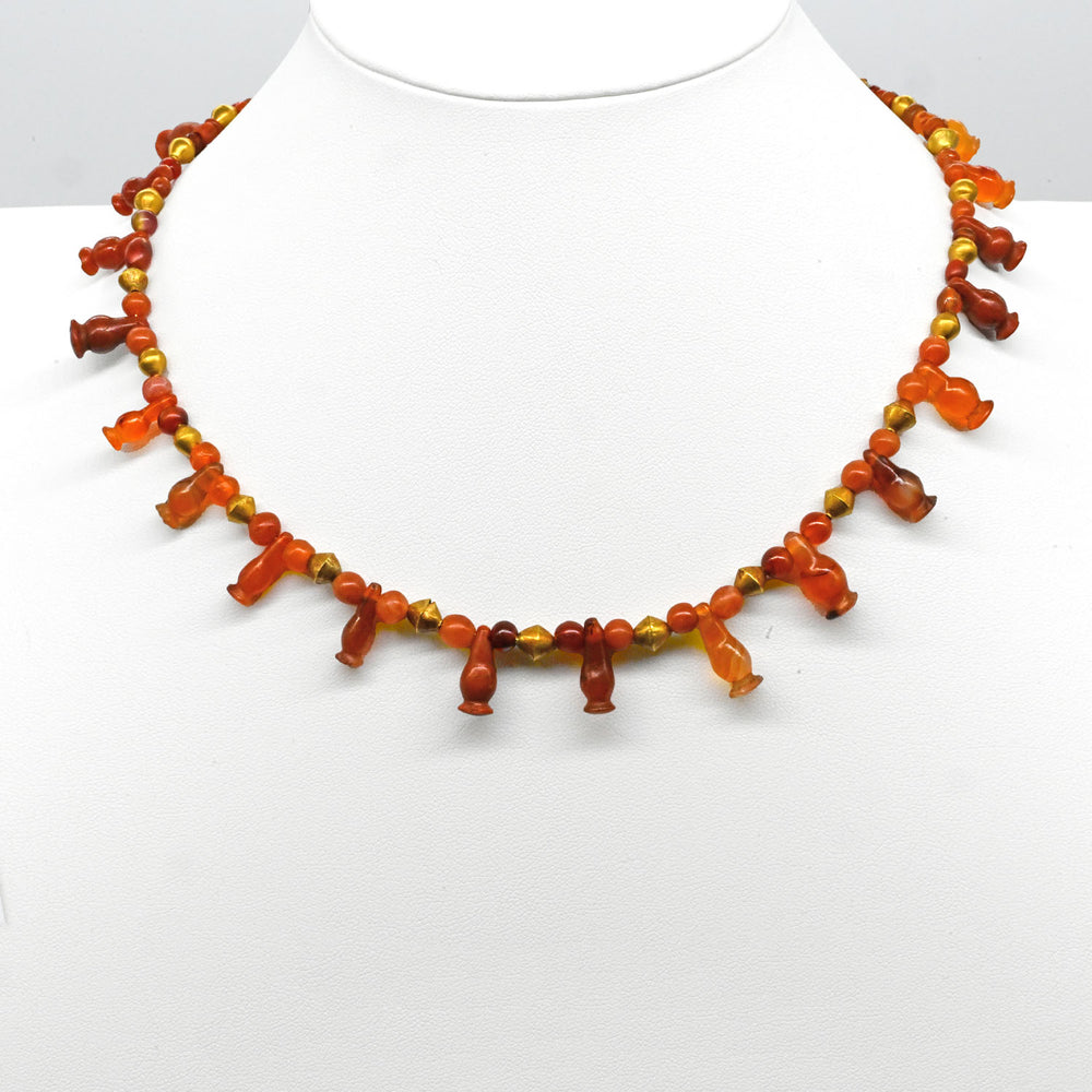 An Egyptian Carnelian, Red Jasper and Gold Bead Necklace, late 18th Dynasty, ca. 1350 - 1295 BCE