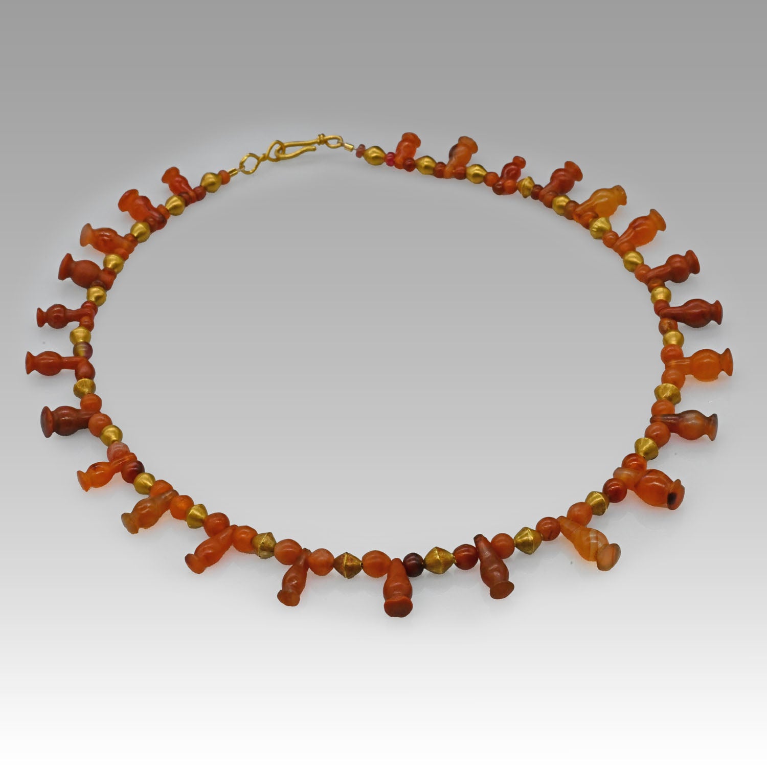 An Egyptian Carnelian, Red Jasper and Gold Bead Necklace, late 18th Dynasty, ca. 1350 - 1295 BCE
