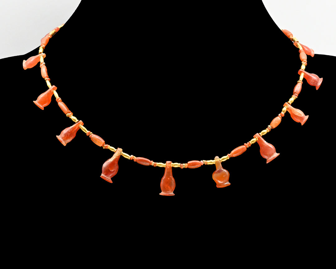 An Egyptian Carnelian Poppy Bead Necklace, 18th Dynasty, Amarna Period, ca.  1364 - 1347 BCE