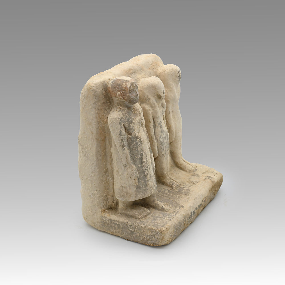 An Egyptian Limestone Family Plaque, Middle Kingdom, 12th Dynasty, ca. 1991 – 1786 BCE
