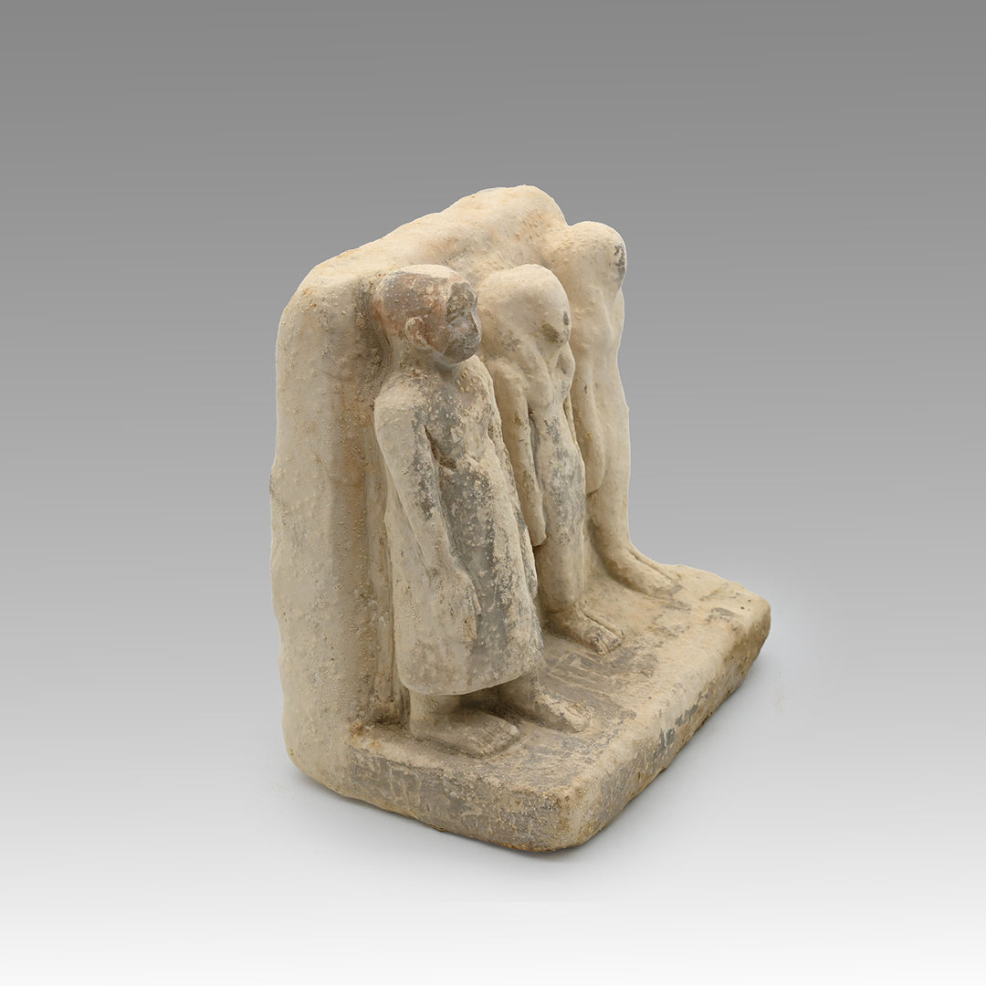 An Egyptian Limestone Family Plaque, Middle Kingdom, 12th Dynasty, ca. 1991 – 1786 BCE