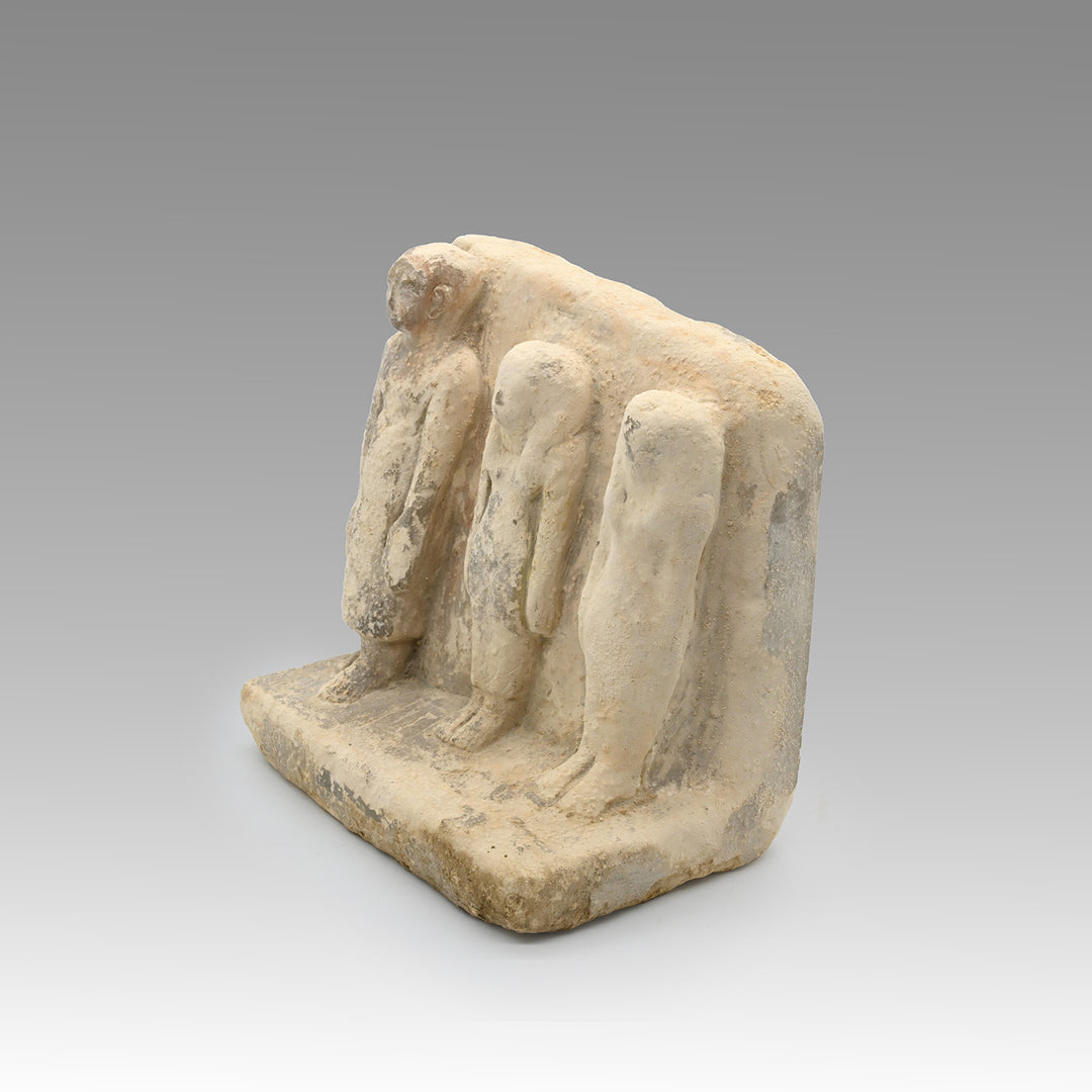 An Egyptian Limestone Family Plaque, Middle Kingdom, 12th Dynasty, ca. 1991 – 1786 BCE