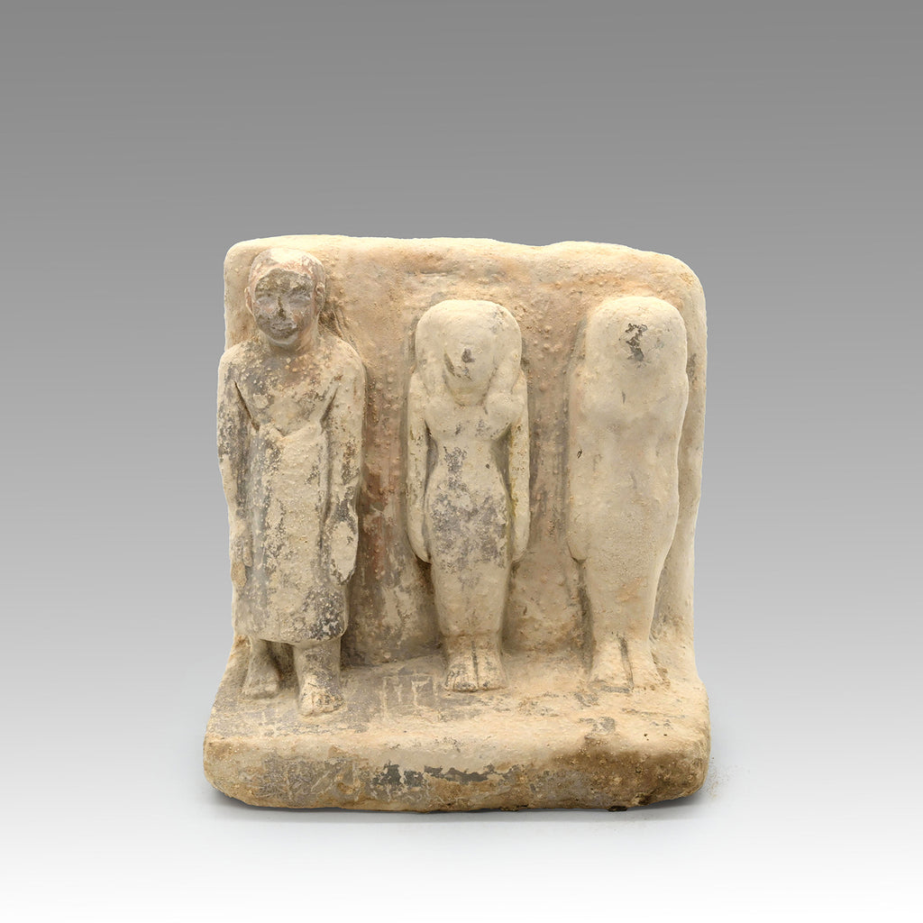 An Egyptian Limestone Family Plaque, Middle Kingdom, 12th Dynasty, ca. 1991 – 1786 BCE