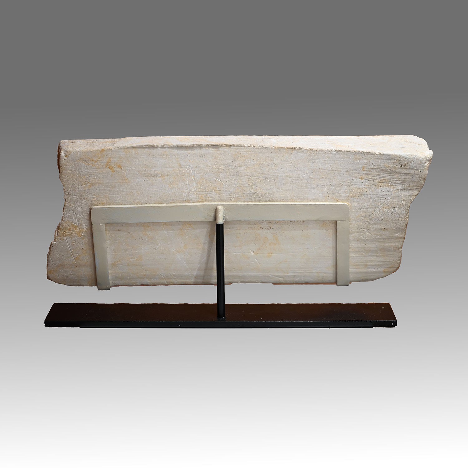 An Egyptian Limestone Relief fragment with Wedjet Eye and Anubis, New Kingdom, 18th Dynasty, ca. 1540 - 1292 BCE