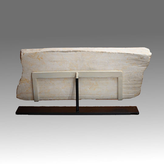 An Egyptian Limestone Relief fragment with Wedjet Eye and Anubis, New Kingdom, 18th Dynasty, ca. 1540 - 1292 BCE