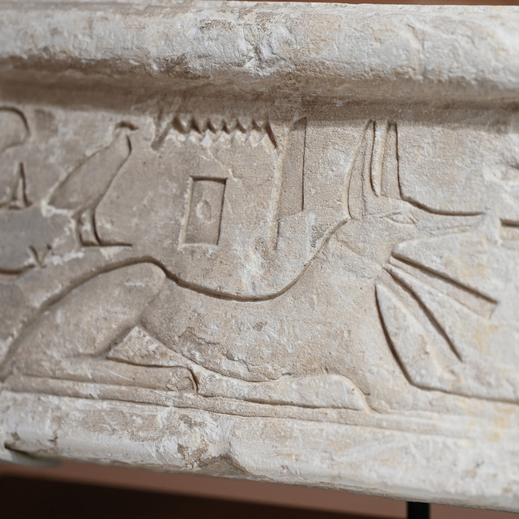 An Egyptian Limestone Relief fragment with Wedjet Eye and Anubis, New Kingdom, 18th Dynasty, ca. 1540 - 1292 BCE