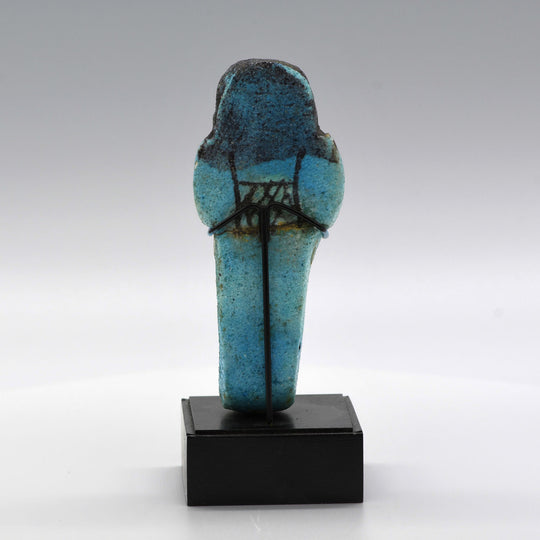 An Egyptian bright blue glazed shabti for Meret-Amun, 21st Dynasty, Thebes, Deir el Bahri Cache II, ca. 990 - 970 BCE