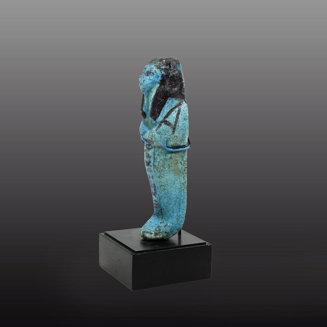 An Egyptian bright blue glazed shabti for Meret-Amun, 21st Dynasty, Thebes, Deir el Bahri Cache II, ca. 990 - 970 BCE