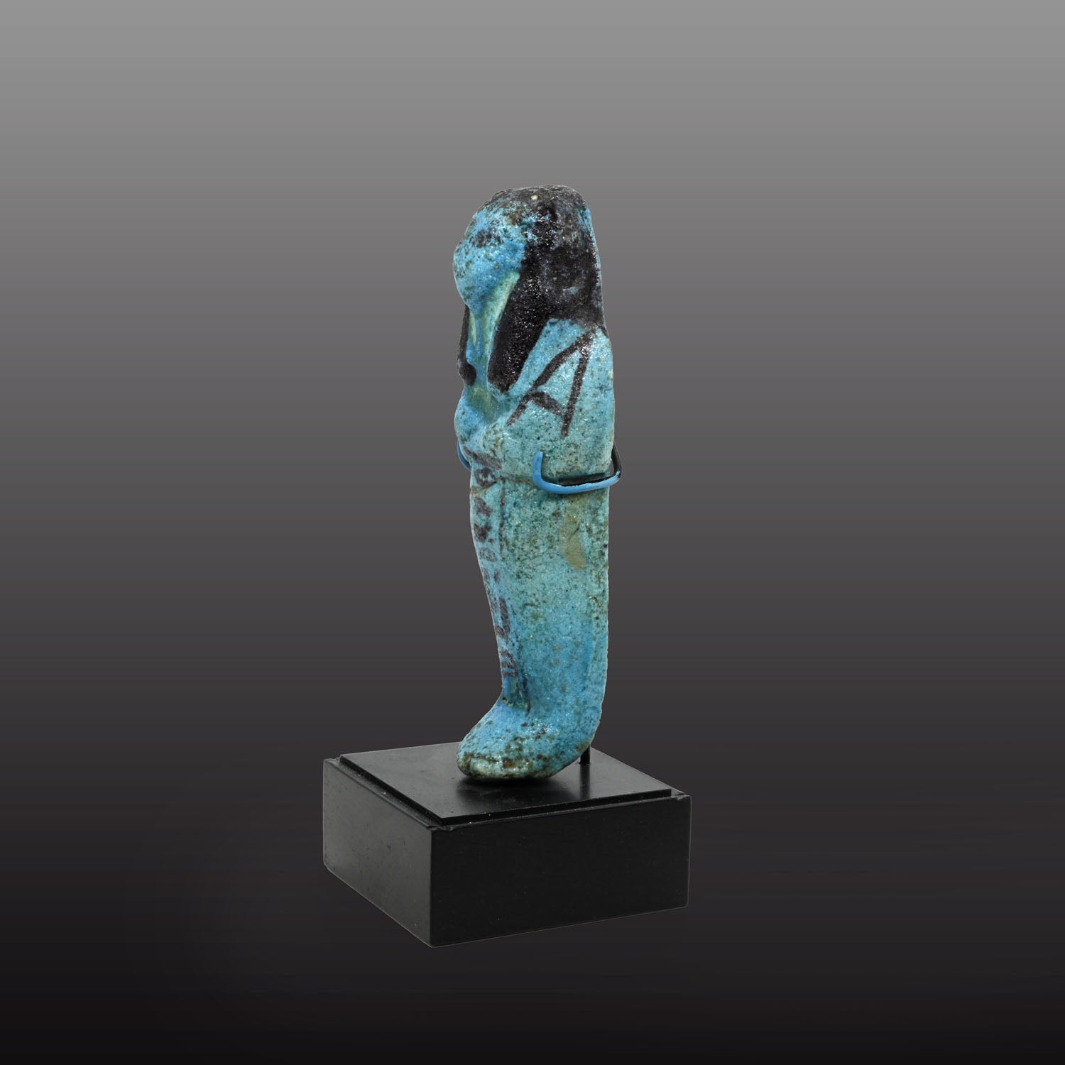 An Egyptian bright blue glazed shabti for Meret-Amun, 21st Dynasty, Thebes, Deir el Bahri Cache II, ca. 990 - 970 BCE