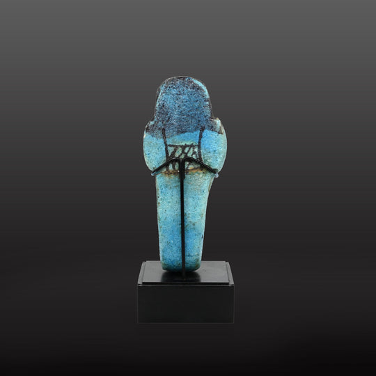 An Egyptian bright blue glazed shabti for Meret-Amun, 21st Dynasty, Thebes, Deir el Bahri Cache II, ca. 990 - 970 BCE