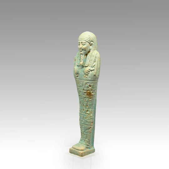An Egyptian Green Glazed Shabti for the scribe Hapmen, 26th Dynasty, ca. 664 - 525 BCE