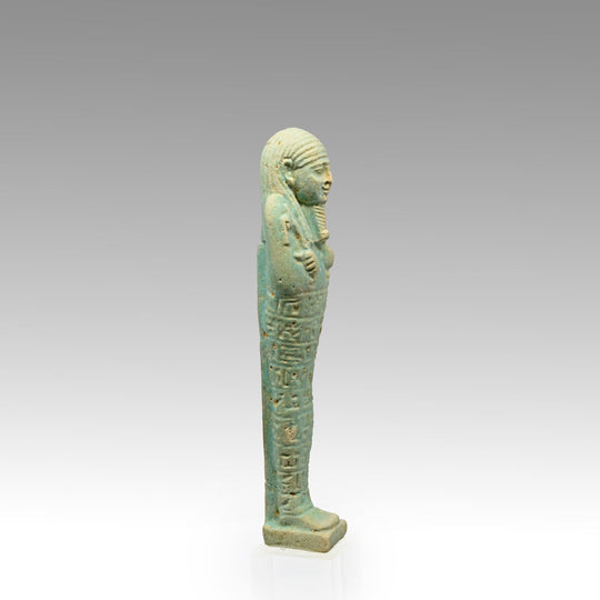 An Egyptian Green Glazed Shabti for the scribe Hapmen, 26th Dynasty, ca. 664 - 525 BCE