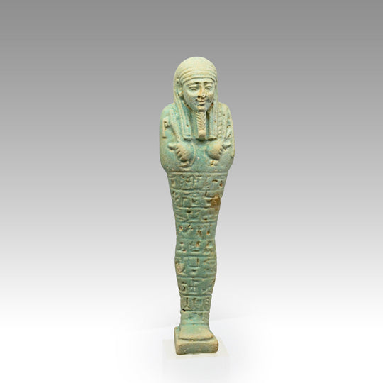 An Egyptian Green Glazed Shabti for the scribe Hapmen, 26th Dynasty, ca. 664 - 525 BCE