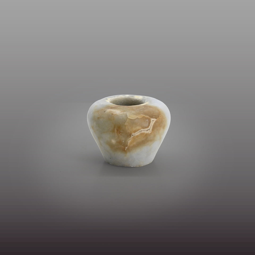 An elegant Egyptian Anhydrite Kohl Vessel, Middle Kingdom, XII Dynasty, not after 1786 BCE