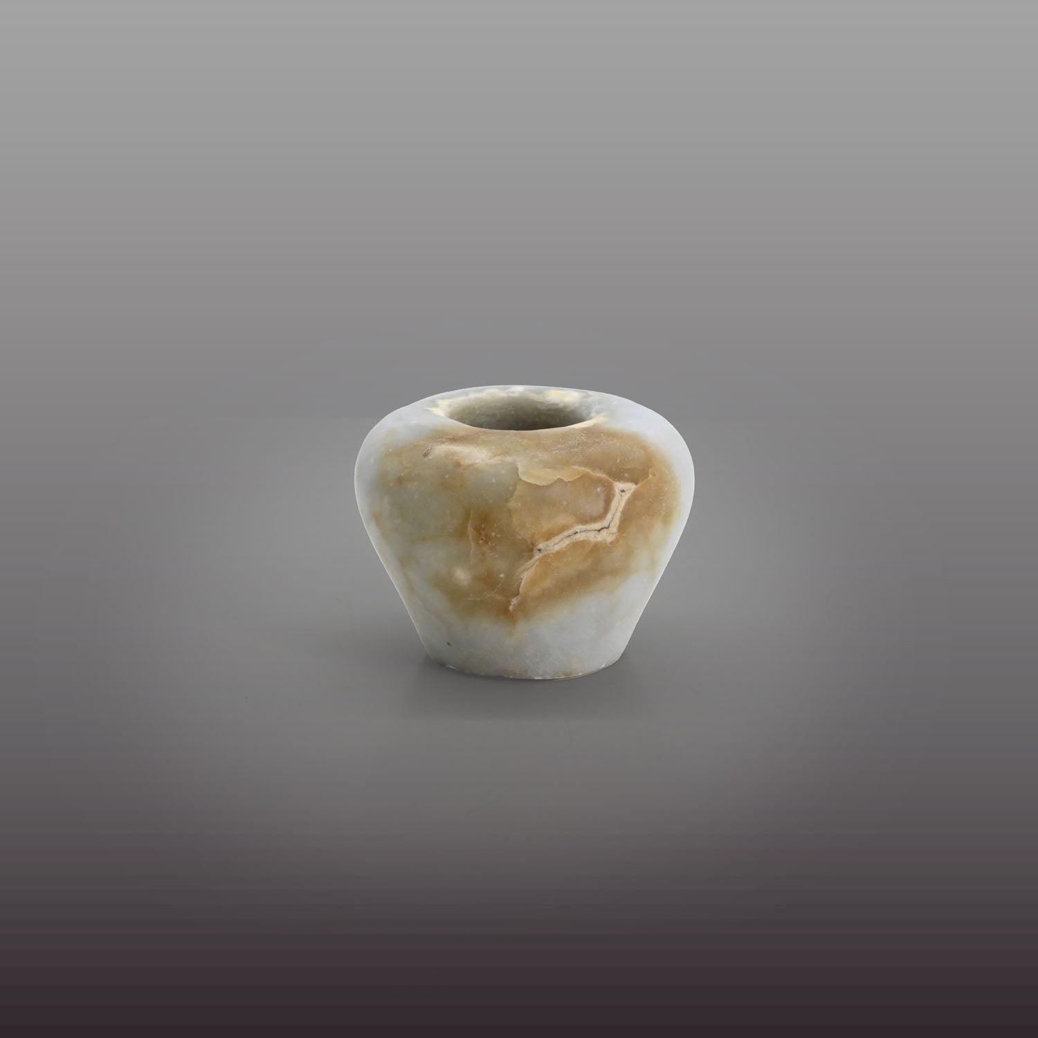 An elegant Egyptian Anhydrite Kohl Vessel, Middle Kingdom, XII Dynasty, not after 1786 BCE