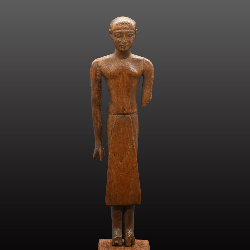 A Fine Egyptian Wooden Standing Dignitary Figure, Middle Kingdom, 11th - 12th Dynasty, ca. 2030 - 1802 BCE