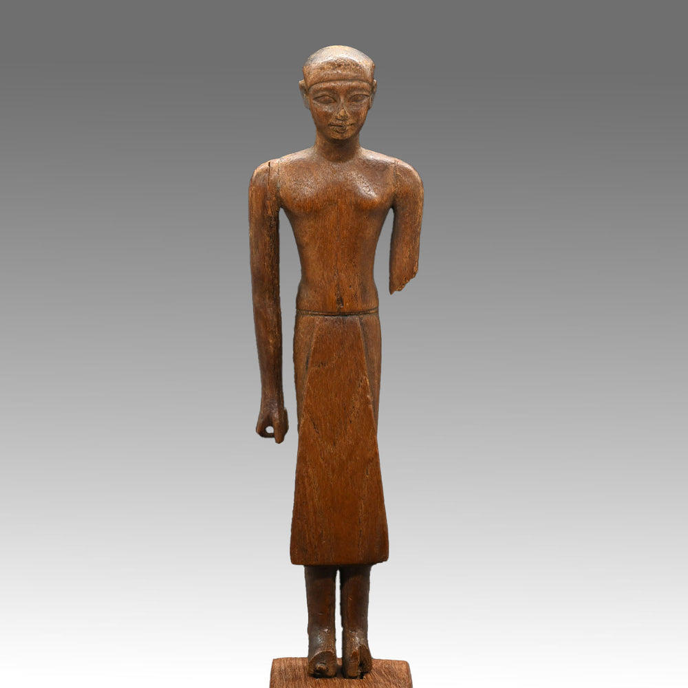 A Fine Egyptian Wooden Standing Dignitary Figure, Middle Kingdom, 11th - 12th Dynasty, ca. 2030 - 1802 BCE