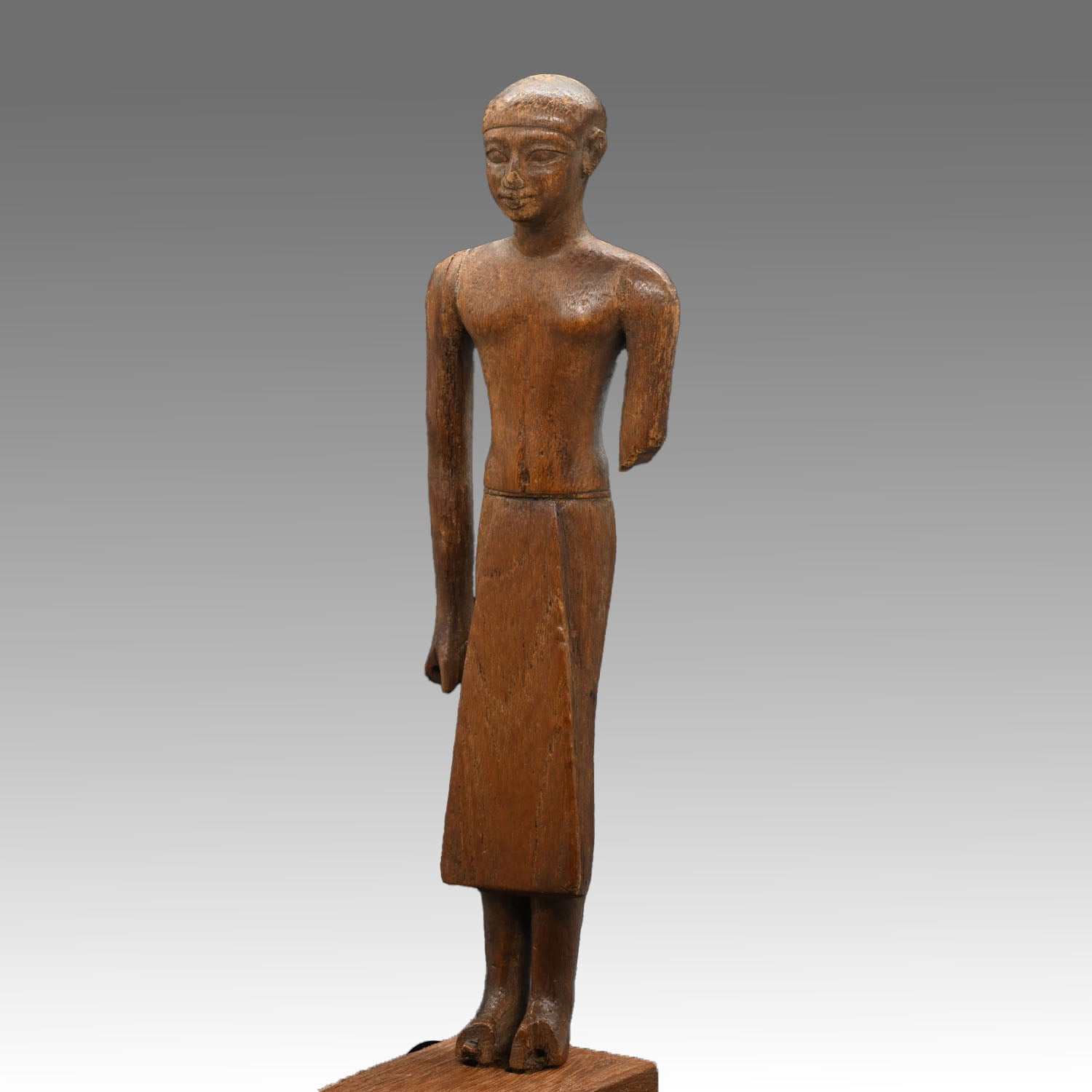 A Fine Egyptian Wooden Standing Dignitary Figure, Middle Kingdom, 11th - 12th Dynasty, ca. 2030 - 1802 BCE